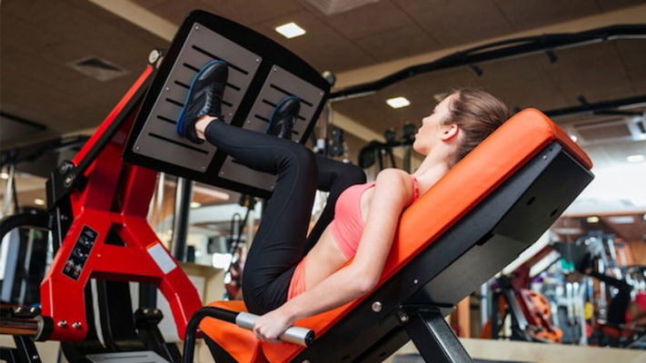 Жим ногами в тренажере для женщин: фото.